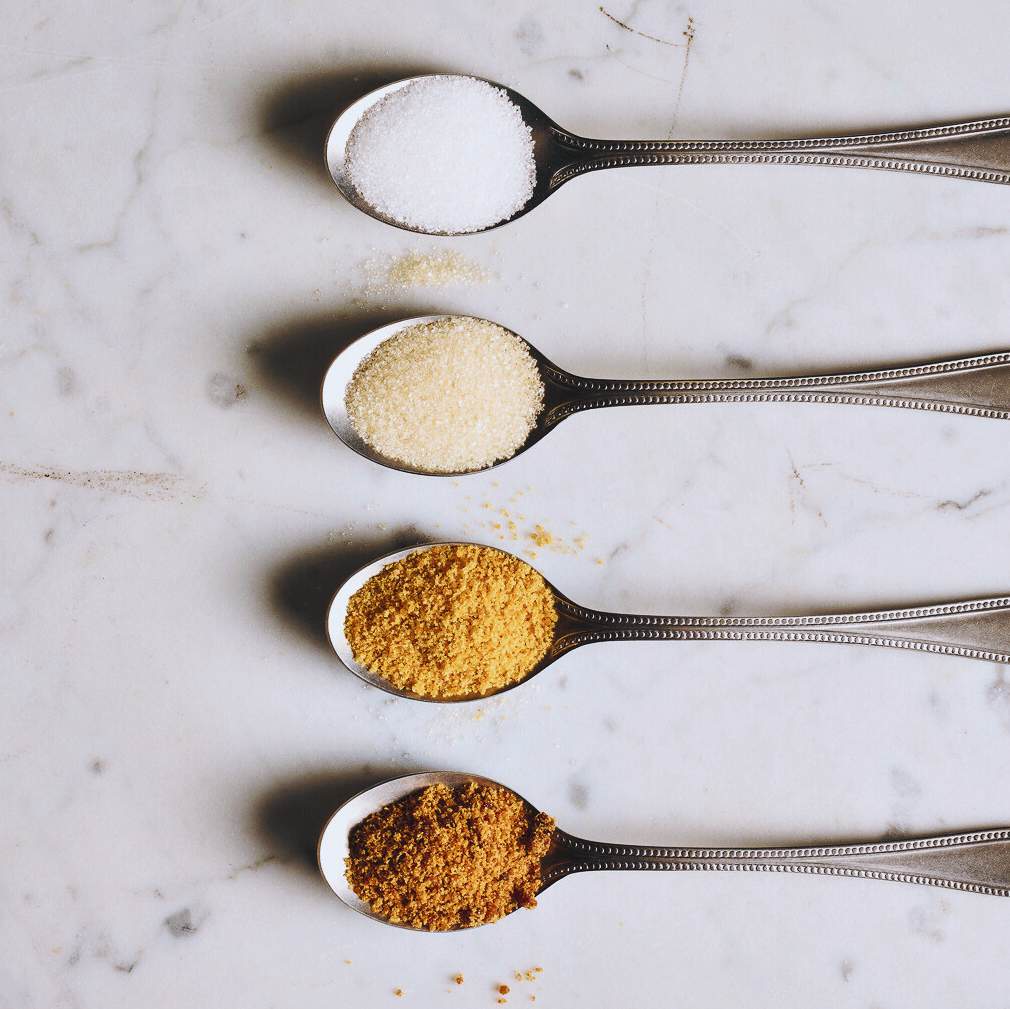 spoons with different types of spices in them